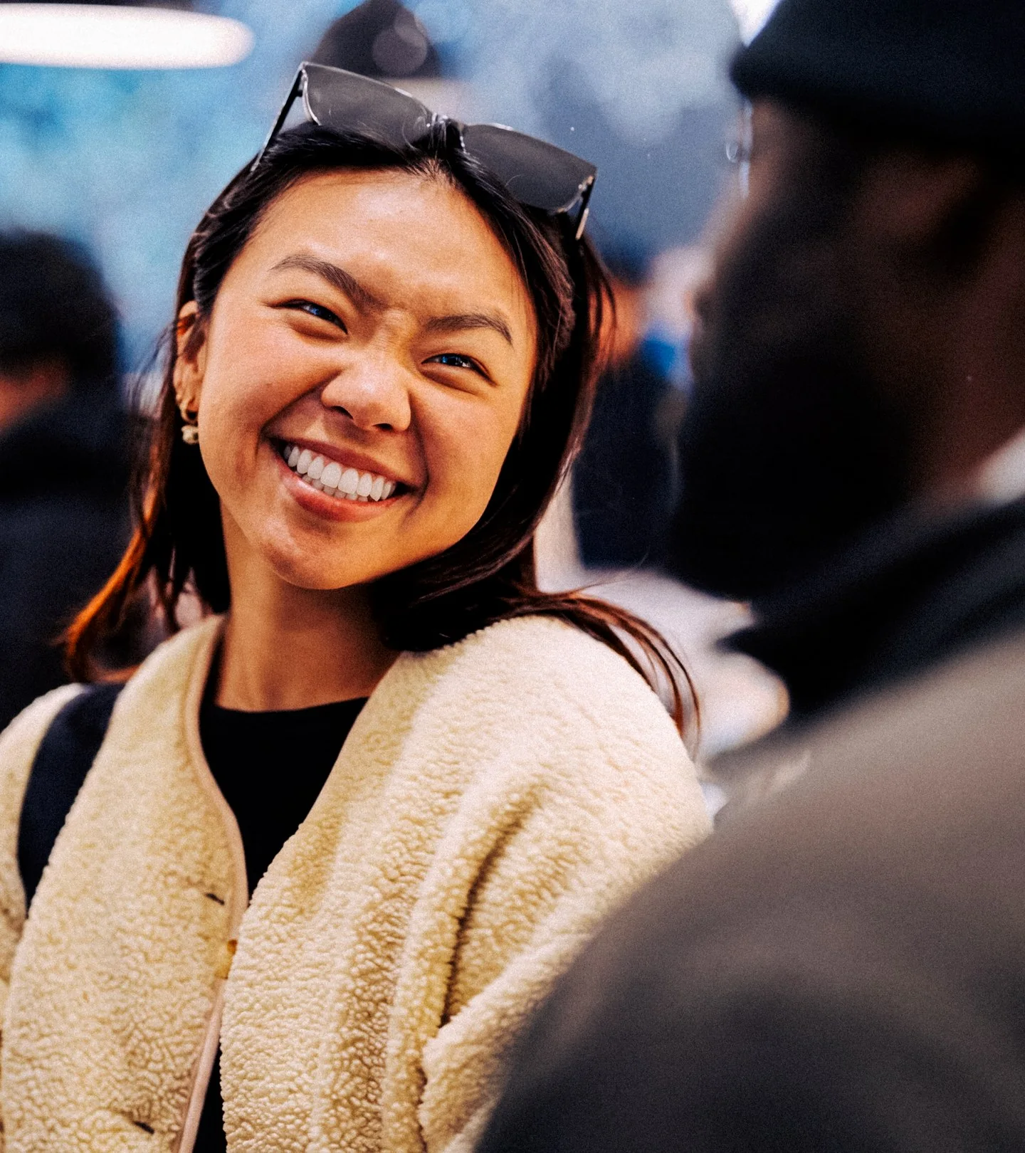 A guest sharing a candid laugh at the event