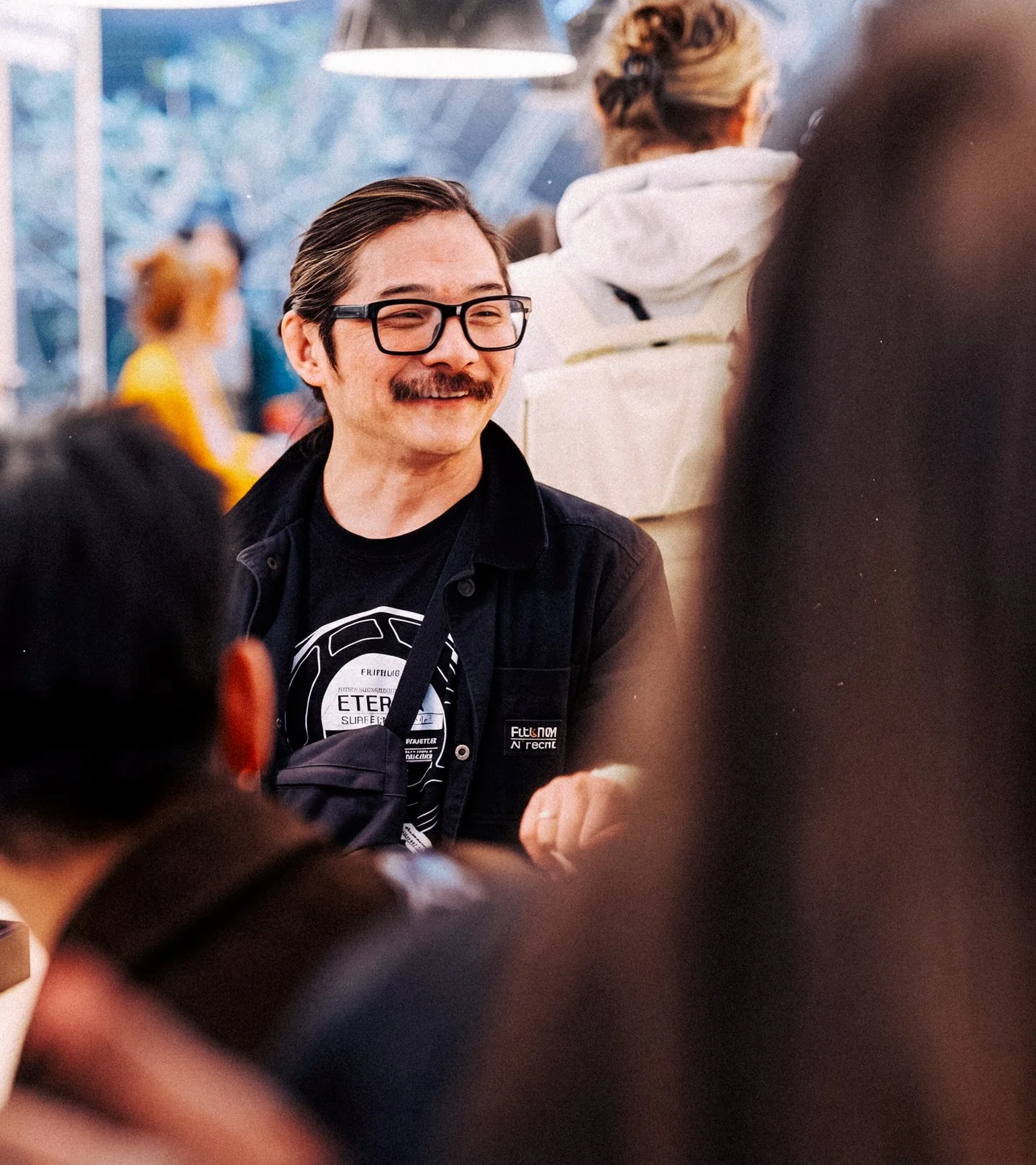 A smiling guest in conversation
